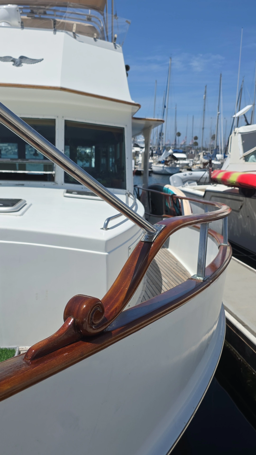 Custom carved teak bowsprit scroll